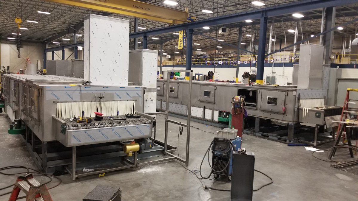 JENFAB_Inc's tweet photo. What a pair! These 2 custom belt washers with conveyors will be cleaning 2 major components of hot water tanks once installed in the customers automation process. They required 4 semi trucks to ship. 4!!!! Wow, what a parade!!!  #manufacturing #automation #partscleaning https://t.co/FwrIqDwhpu