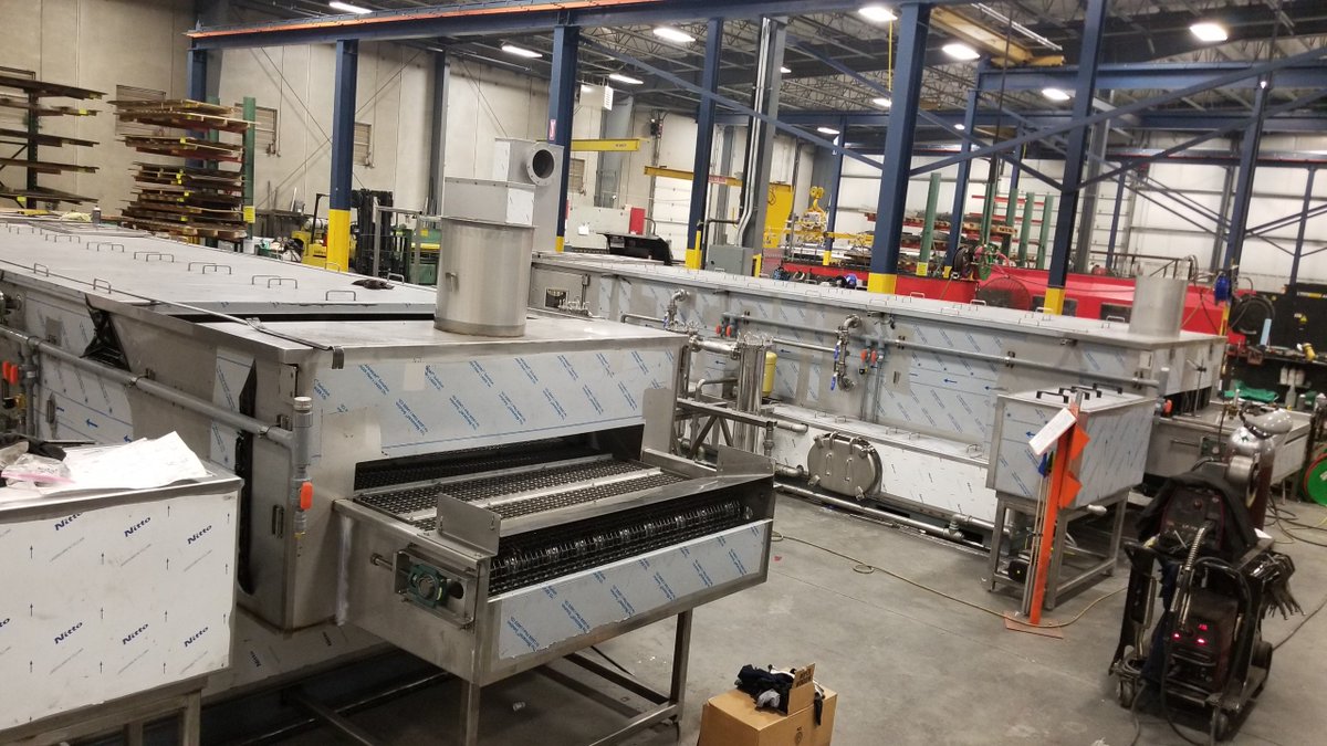 JENFAB_Inc's tweet photo. What a pair! These 2 custom belt washers with conveyors will be cleaning 2 major components of hot water tanks once installed in the customers automation process. They required 4 semi trucks to ship. 4!!!! Wow, what a parade!!!  #manufacturing #automation #partscleaning https://t.co/FwrIqDwhpu