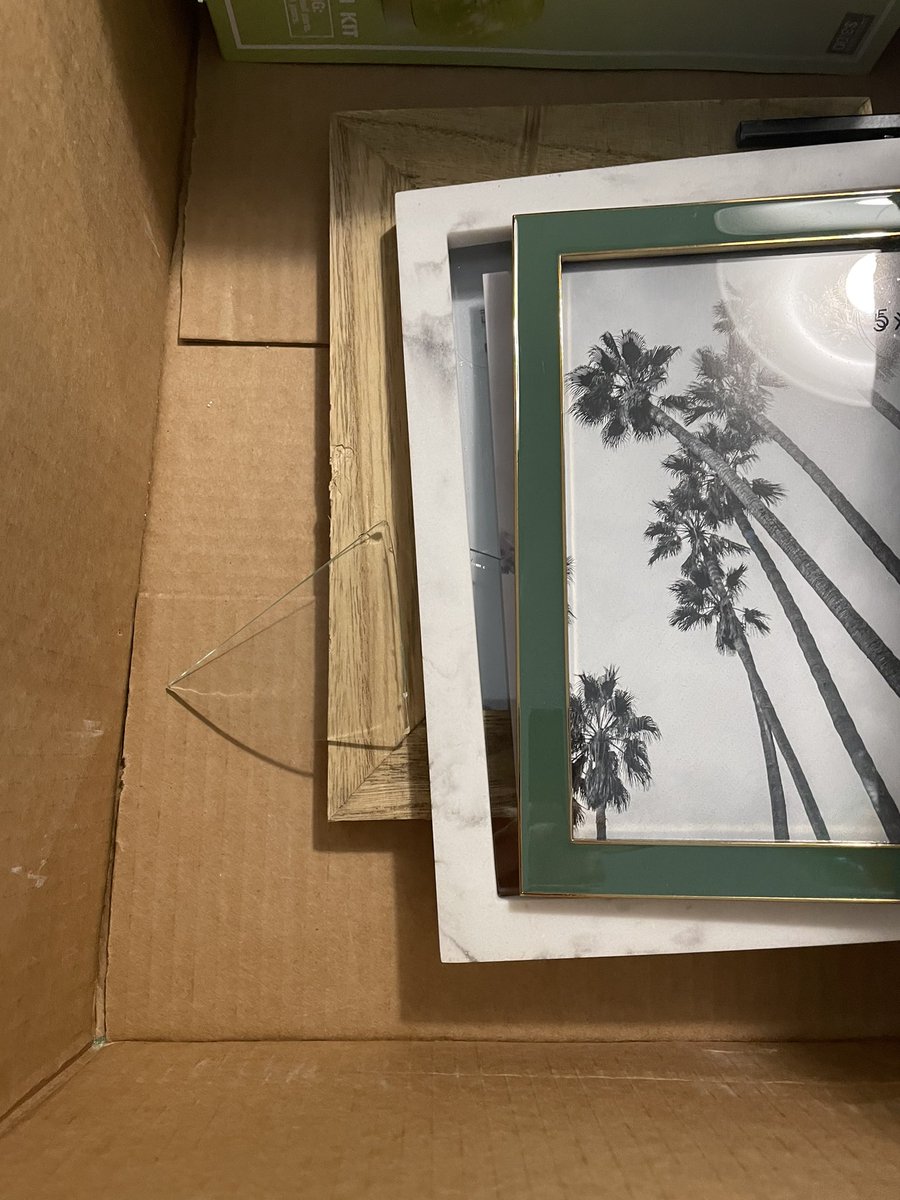 Fauxmingo's tweet photo. @Target This is how 3 of your picture frames were packaged and shipped to me - obviously they all arrived broken and the rest of my order was full of glass shards! https://t.co/fF2A0MyVhR