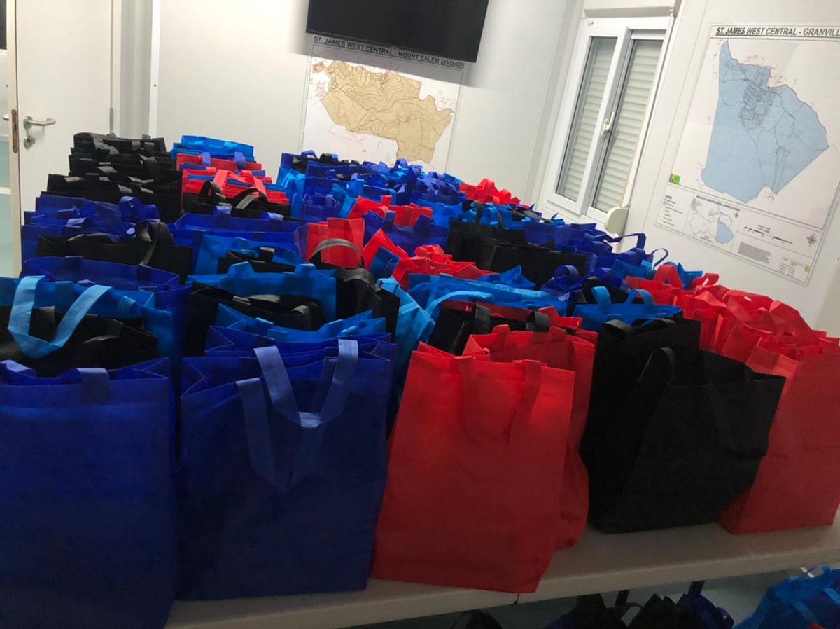 StJamesWCJLP's tweet photo. #TeamMarlene putting together 100s of bags with Buns | Cheese, bringing Easter cheers to needy constituents in observance of the tradition during the Holy Season.
The @StJamesWCJLP Constituency's #WorkingMP is @MalahooForteQC with #CllrDwightCrawford, #RenaForbes, #BryanHosue. https://t.co/4gpYBAMb9X