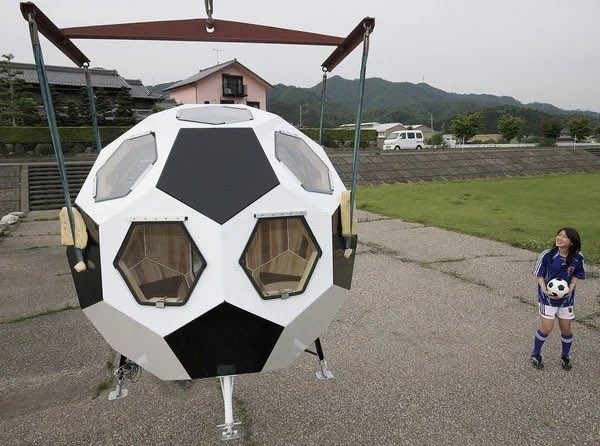 F3dotca's tweet photo. Japanese television presenter looks at a disaster resistant Japanese soccer-ball-shaped home designed by Kimidori Housing in Gifu, Japan. https://t.co/ACjBnaluzJ