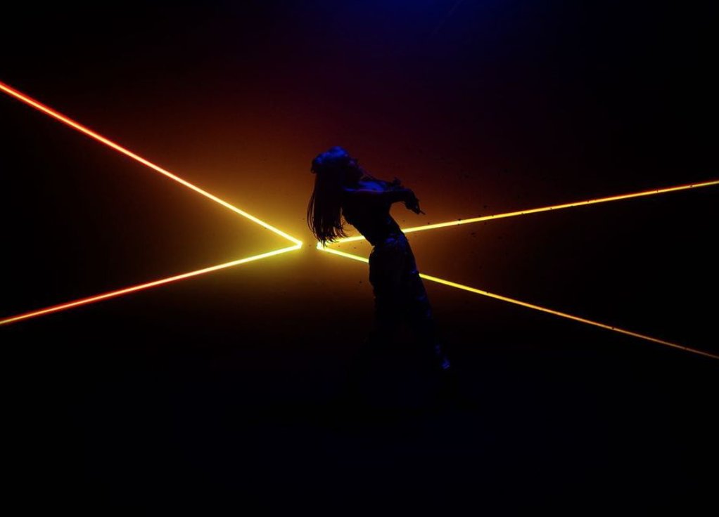 LindseyStirling's tweet photo. Fact: lasers can blind you. So while I was performing in this tiny laser cone, I had to be super careful to not “touch” the lasers with my face. This was easier said than done while doing backbends in 6 " heals #leagueoflegends 📸 https://t.co/CjCkRdjzqg https://t.co/VgtSnWFmLt