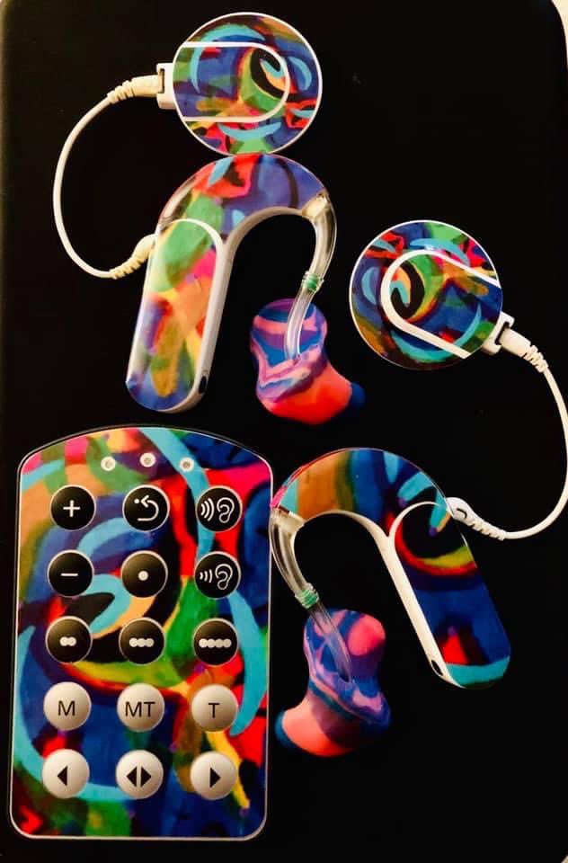 sarahlovesears's tweet photo. I love seeing people share photos of their colorful, decorated hearing tech! These are my cochlear implant processors. Every few months, I have one of my paintings printed onto sticker skins for them. My CIs aren’t all of me, but they’re an important part of who I am. 🦻🏻 🎨 🖌 🤟🏻 https://t.co/BuBqMDUSvR