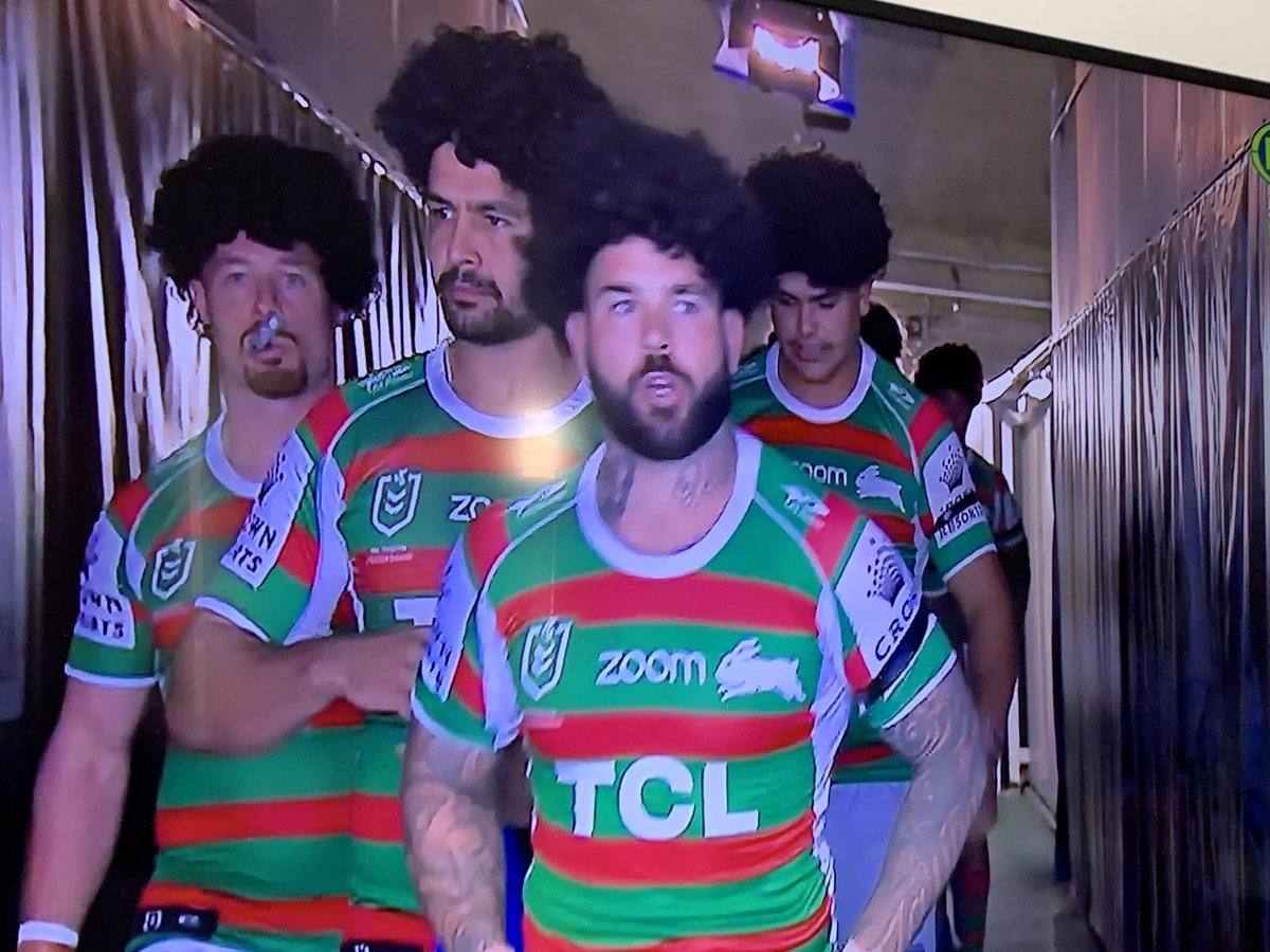 bethhewat's tweet photo. @MoseMasoe @SuperLeagueRL @NRL Iβm not a bunnies fan but this was great - South Sydney today wearing wigs to show support for you - best wishes from the Good Coast #StandWithMose https://t.co/9Wdf3PolS0