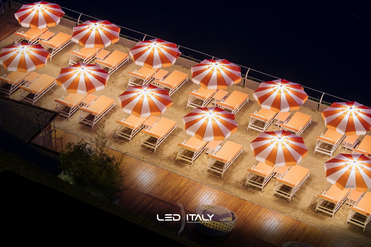 LedItaly's tweet photo. Lo splendido T Beach di Como, rinnova la sua immagine notturna grazie alla collaborazione con LED ITALY e TECHNO.  
Il progetto custom, prevede l’illuminazione degli ombrelloni che caratterizzano la spiaggia del lido.
Lighting designer: Silvia Perego - Ph. Stefano Anzini https://t.co/WMBbRKZiPM