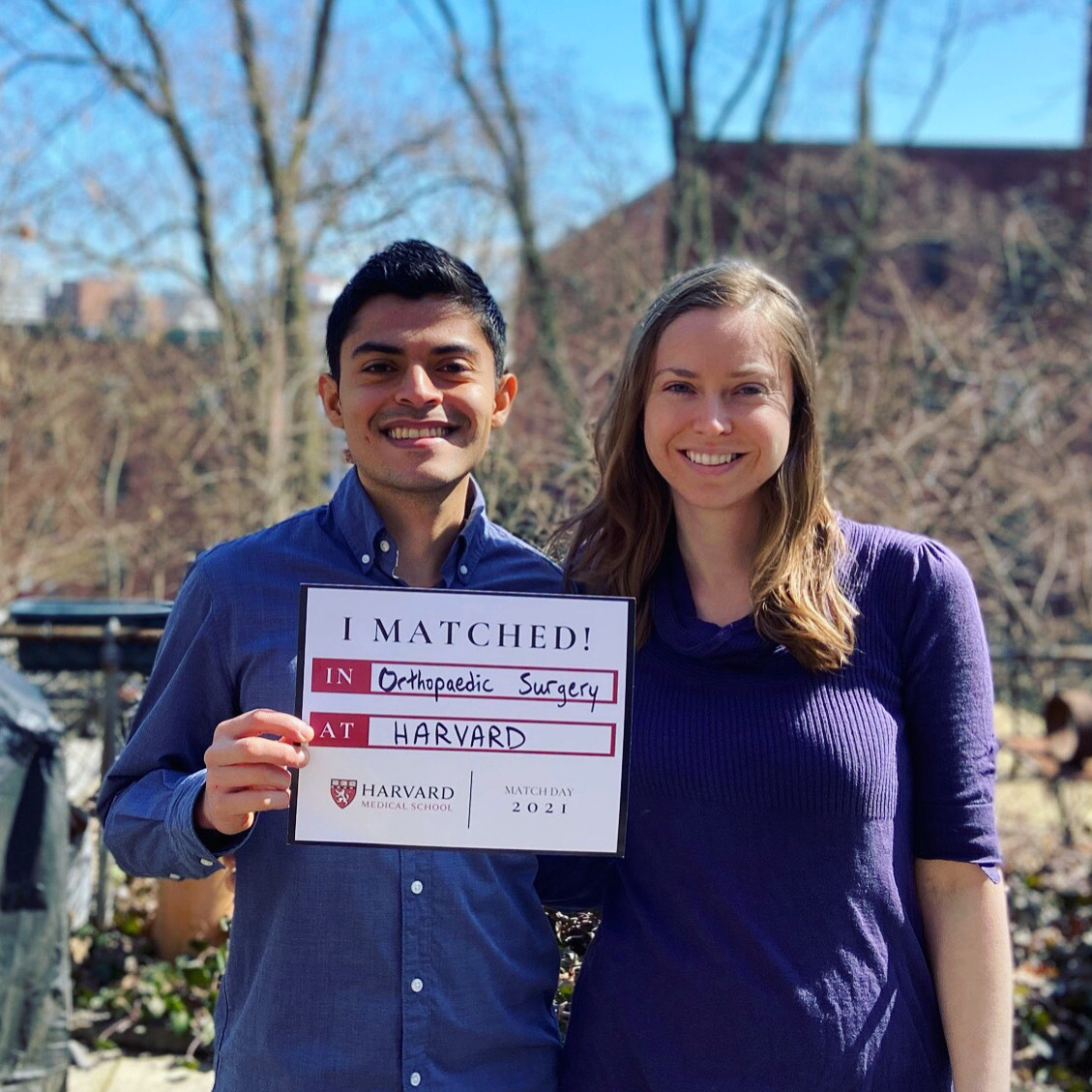 Two students hold a sign that reads, "I matched!"