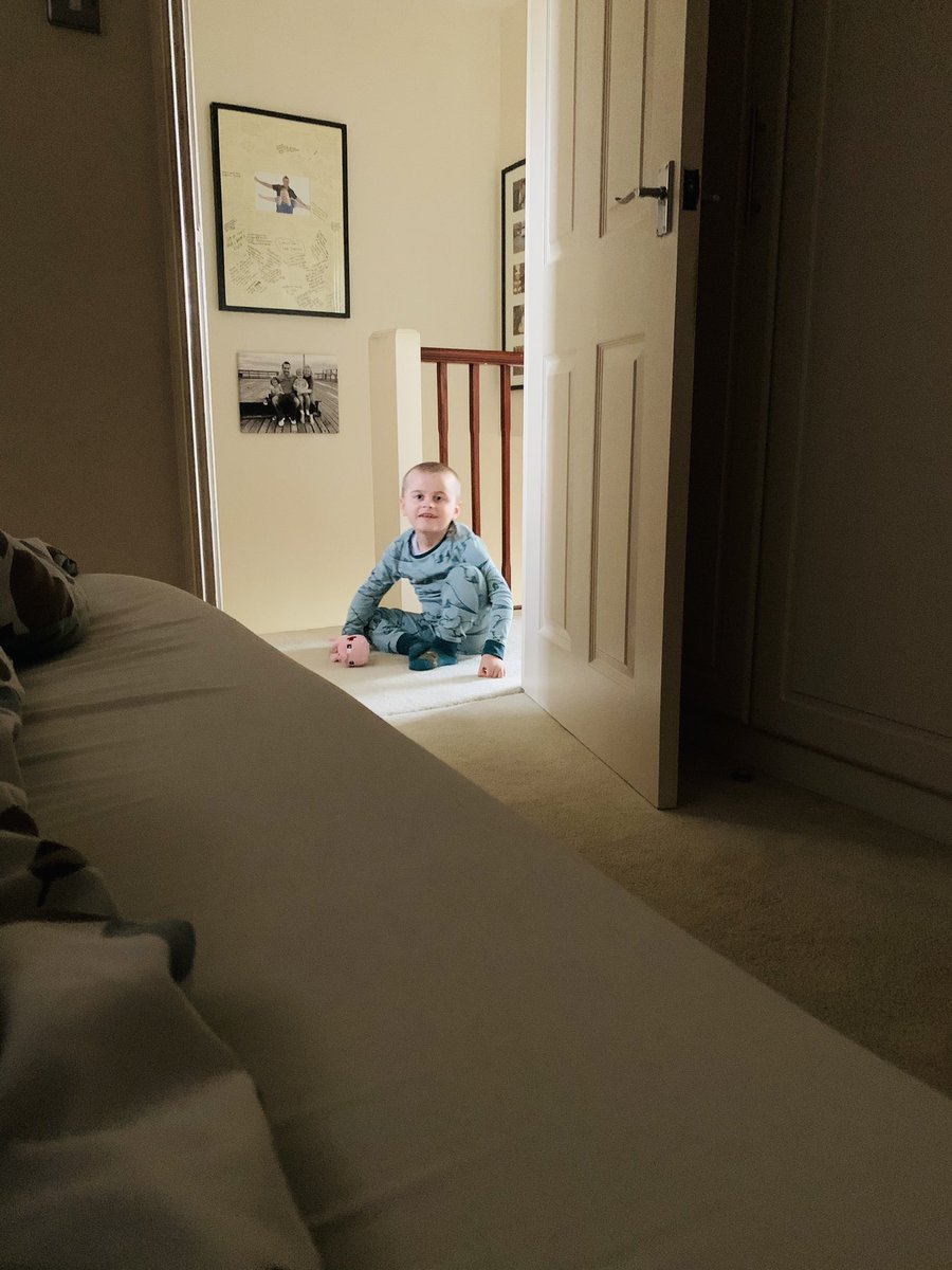 8 year old Fraser sat on his bottom at Shelley’s bedroom door peering in.