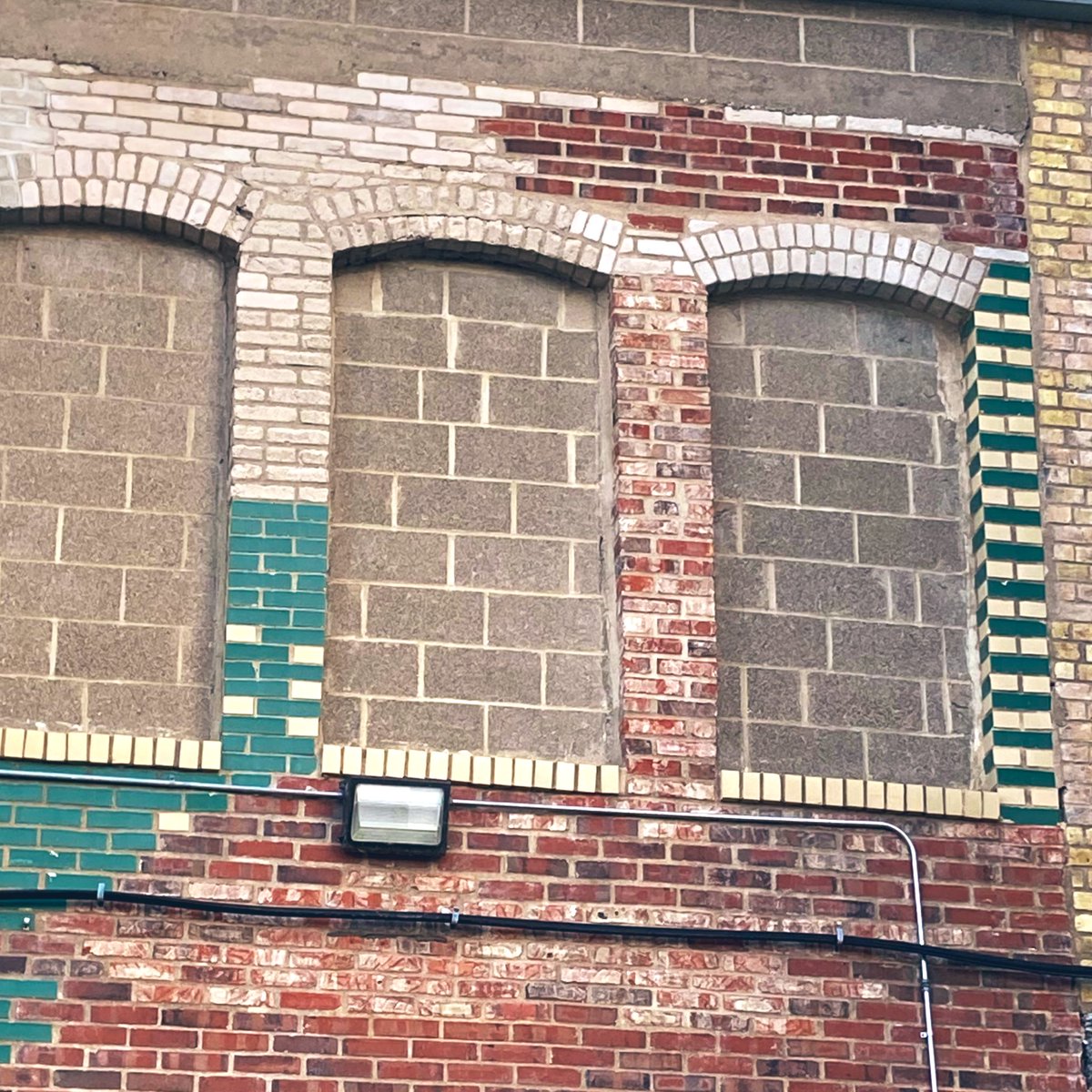 So many varieties of brick! I love the patchwork and function-first feel of this whole facade