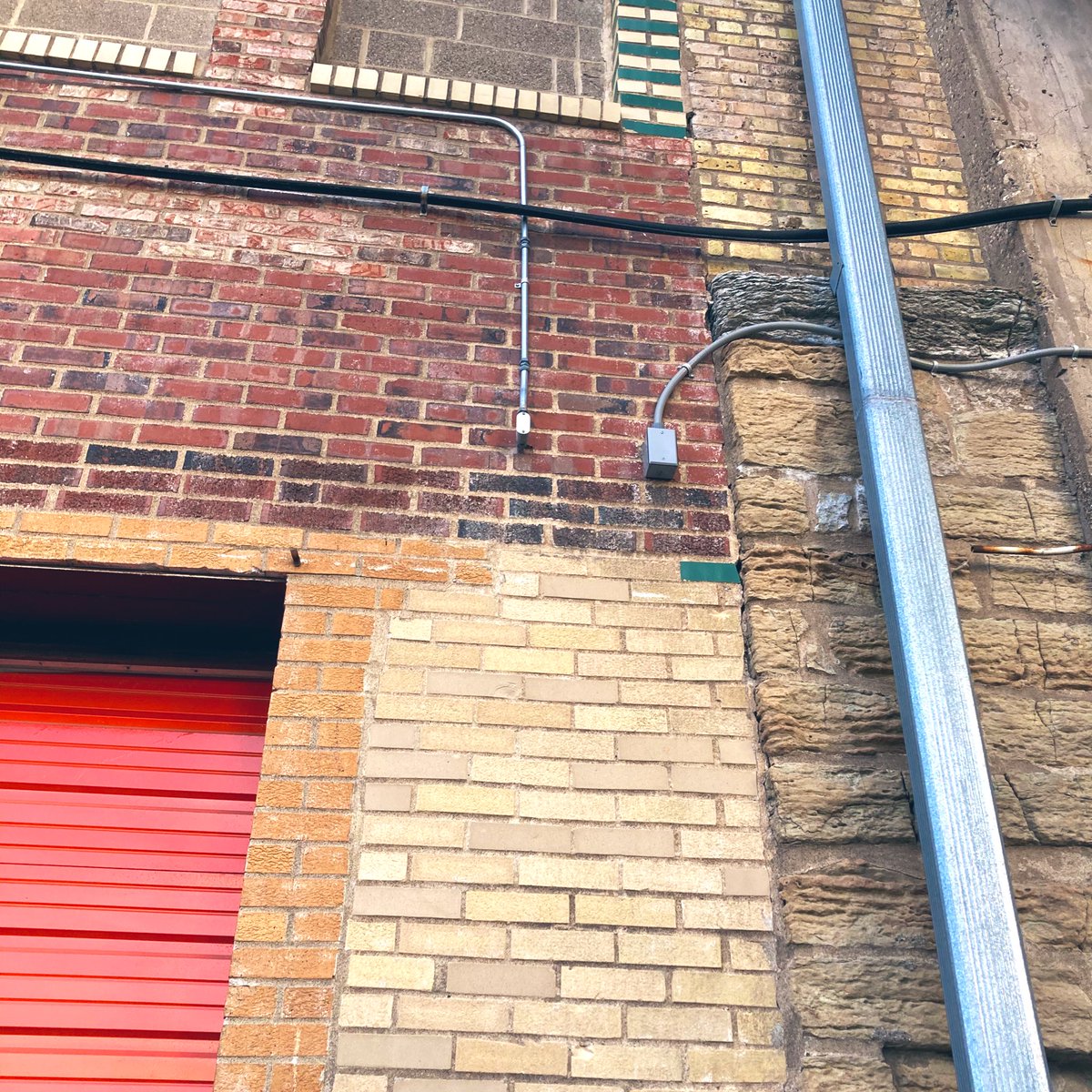 So many varieties of brick! I love the patchwork and function-first feel of this whole facade