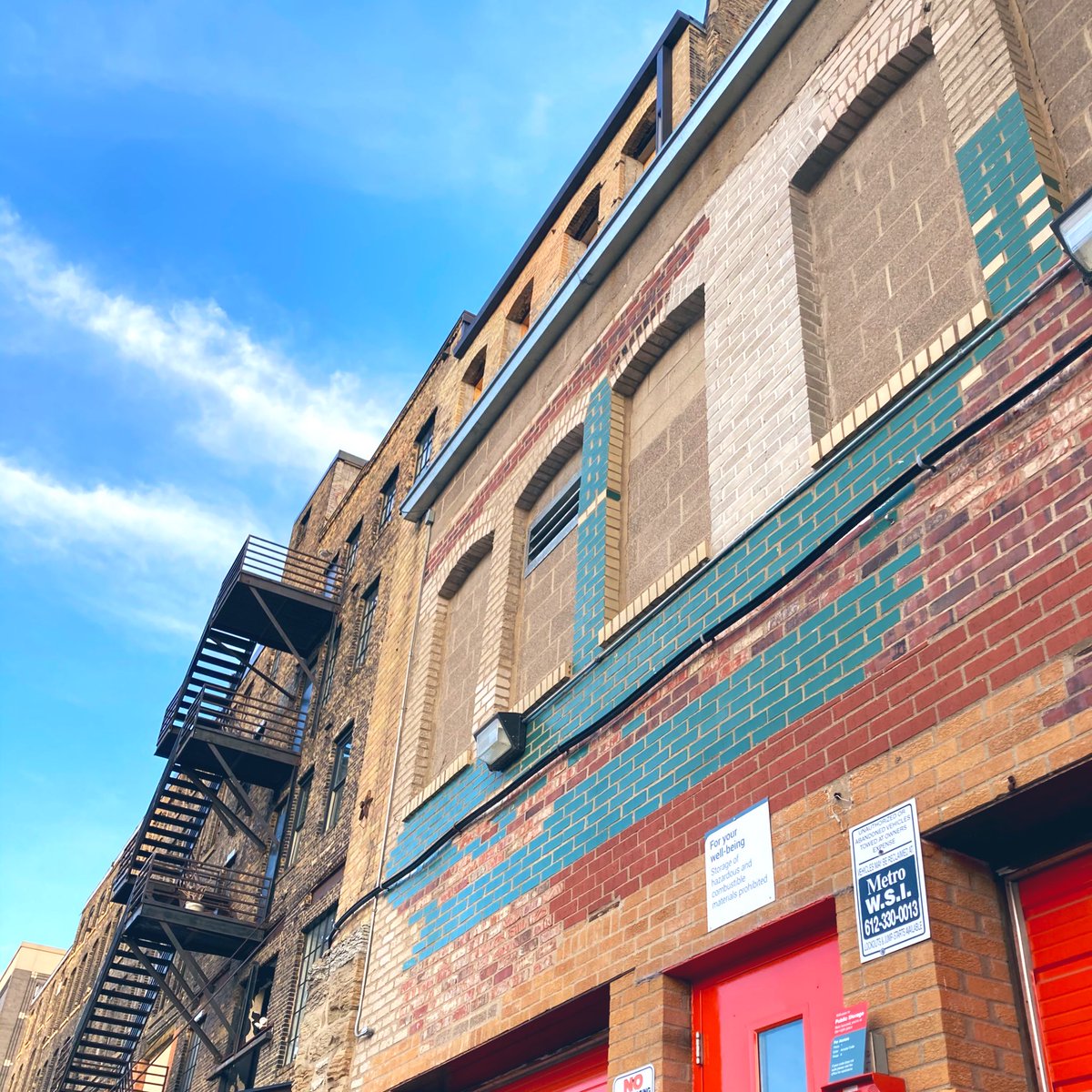 So many varieties of brick! I love the patchwork and function-first feel of this whole facade