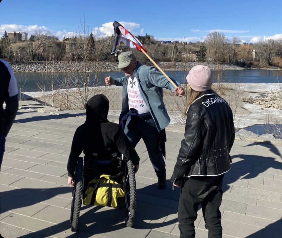 __UV__UV__'s tweet photo. @jkenney @UCPCaucus Why don't you move your focus to finding this asshat who assaulted a disabled person during a lockdown protest https://t.co/7PSxXY2tOR