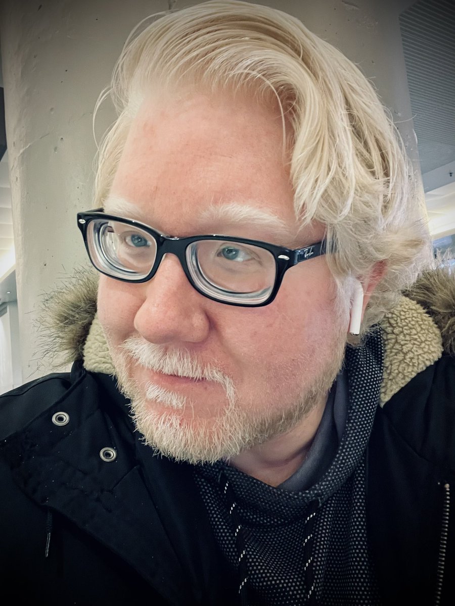 Selfie showing my long hair that has grown to past my ears.