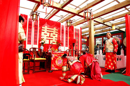 THE THREE BOWS This is known as 拜堂 bàitáng. After this, the bride is officially part of the husband's family. 一拜天地 First bow to heaven and earth: to pay respect to the deities. This is done by bowing or kowtowing in the direction of the main door.