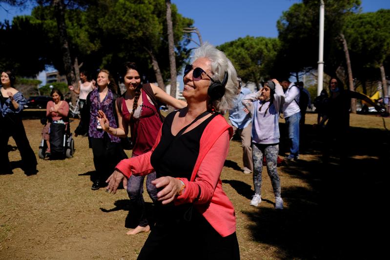 Reuters's tweet photo. Ravers feel the music at socially distanced silent disco in Barcelona https://t.co/kTWWhmHm1F https://t.co/qRb9FtHyD0