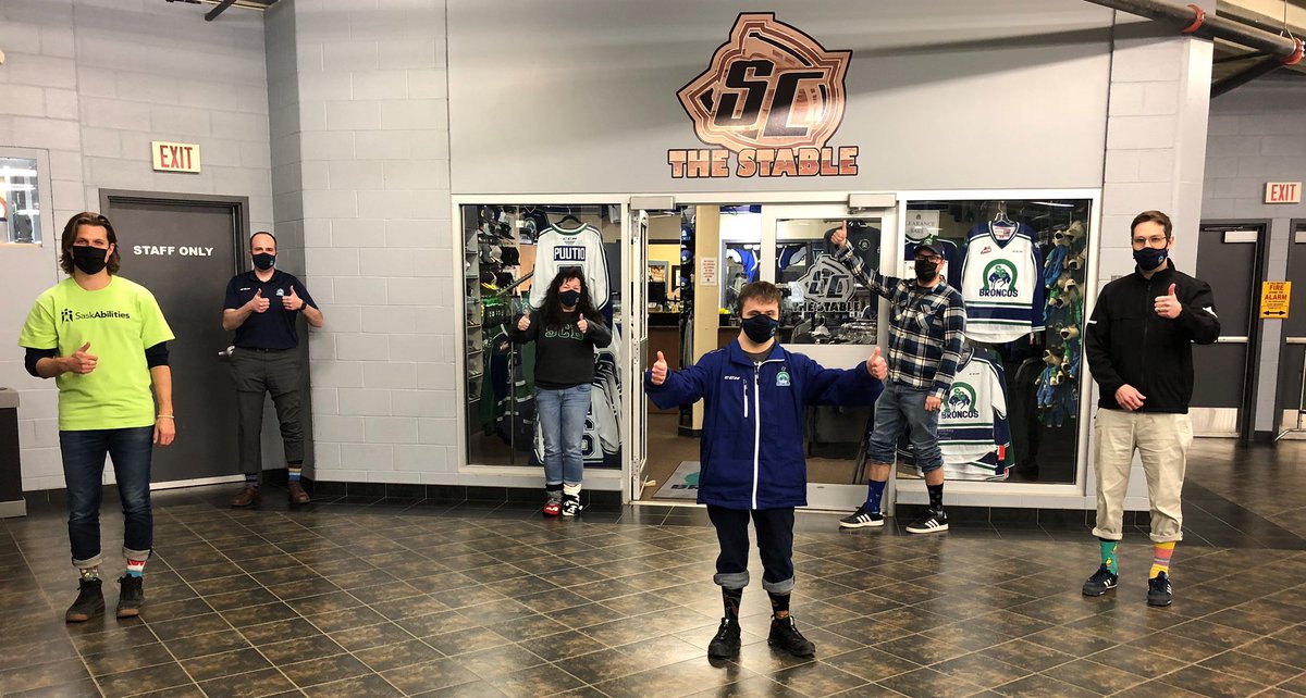 SCBroncos's tweet photo. Some of our staff are joining in from our home base in Swifty by #Rockingthesocks in support of World Down Syndrome Day with special appearance from Dillon Currie of @SCAbilities and Nolan!
 #LotsOfSocks #SeeTheAbility #WDSD #WorldDownSyndromeDay #SaskAbilities #RespectinSport https://t.co/nj0qXu5RsR