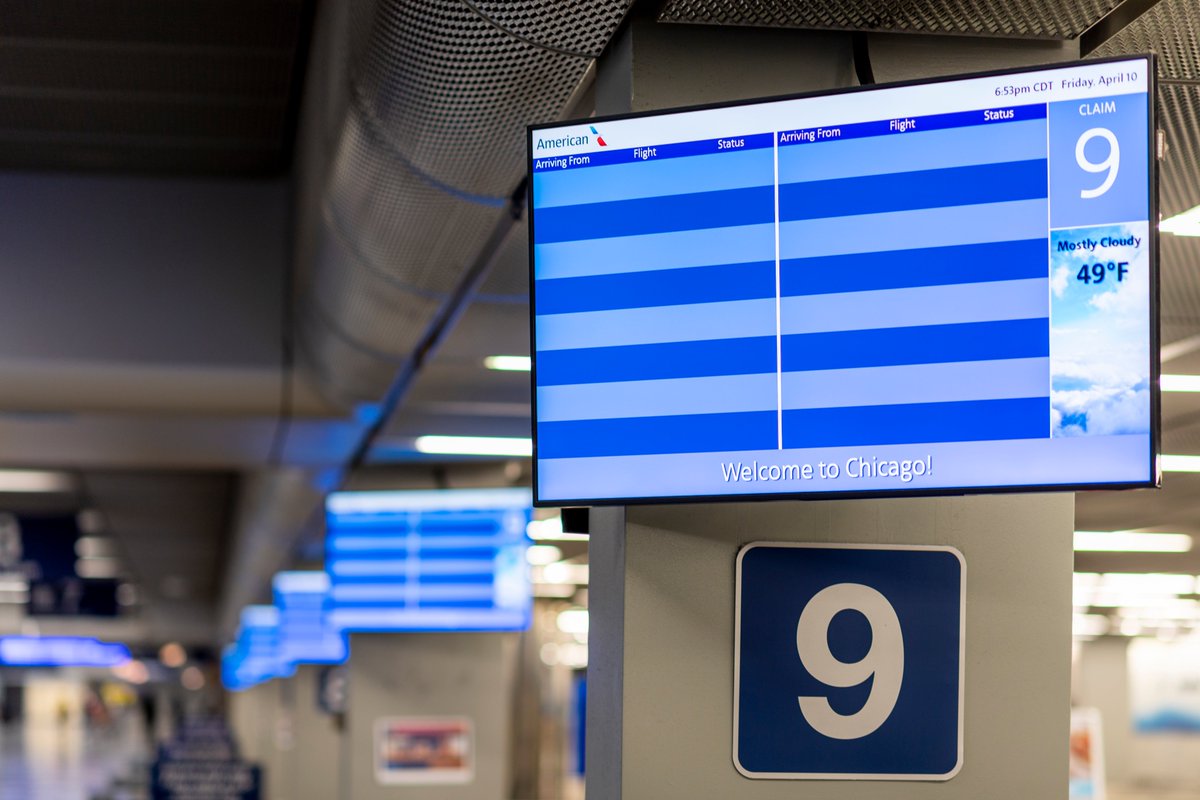 This is a photo of an empty “arrivals” and “departures” screen at O’Hare International Airport.