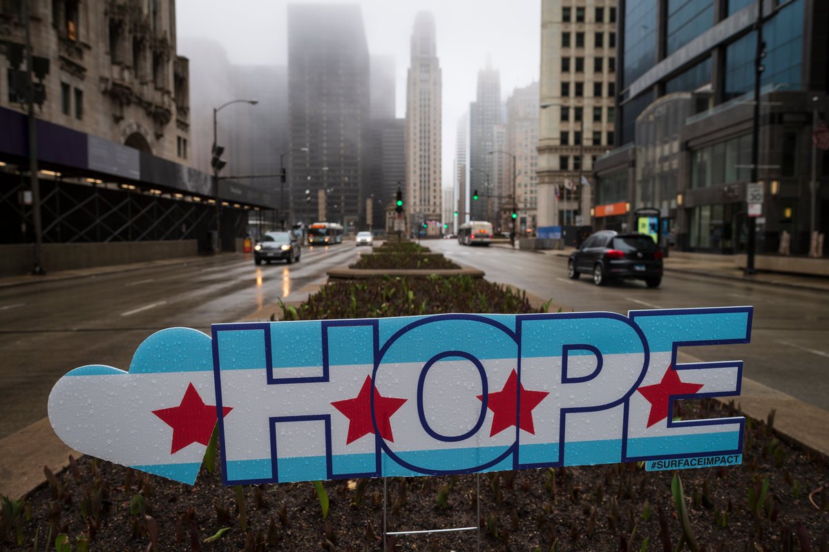 This is a photo of a sign that says “hope” on a North Michigan Avenue median