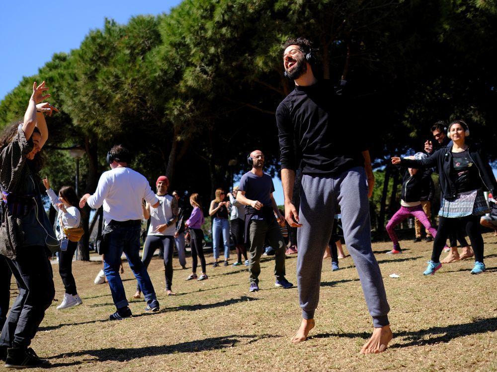 Ravers feel the music at socially distanced silent disco in Barcelona