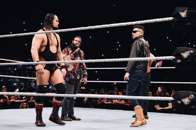 akaworldwide's tweet photo. Hmmm ... maybe, but my boots 👢 put both of you to shame. Good win last night. @WWERollins https://t.co/jNWTbiN8lF