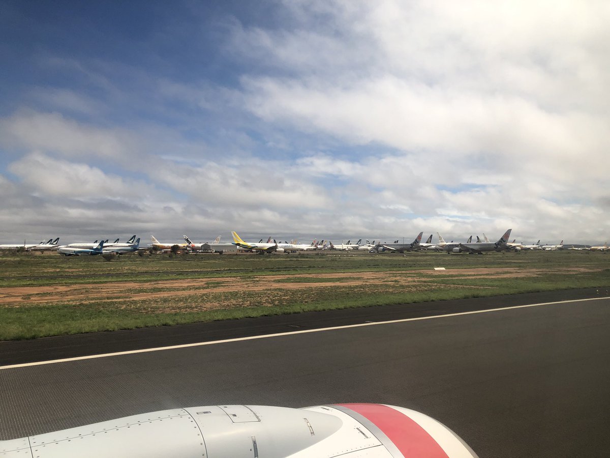 deannalush's tweet photo. Biggest surprise flying in to Alice Springs this arvo (other than the balmy 24C weather!) ... 157 planes still parked, waiting for the #COVID storm to pass. Just when you feel like a bit of normal is coming back, there’s still some pretty stark reminders in Aus. @AgCommunicators https://t.co/JbgsDOghz5
