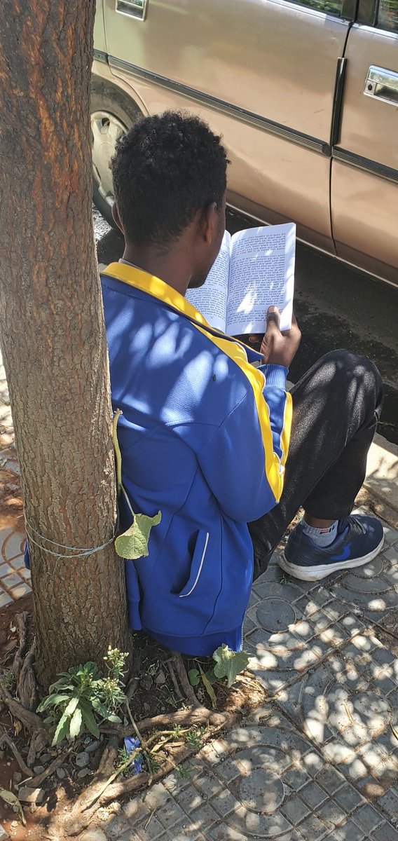 GetachewSS's tweet photo. This young man asked to look after my car. When I came back, not only did he clean it well but waited for me, while reading. 😍 #EverydayEthiopia https://t.co/eJ1zNxAMJS