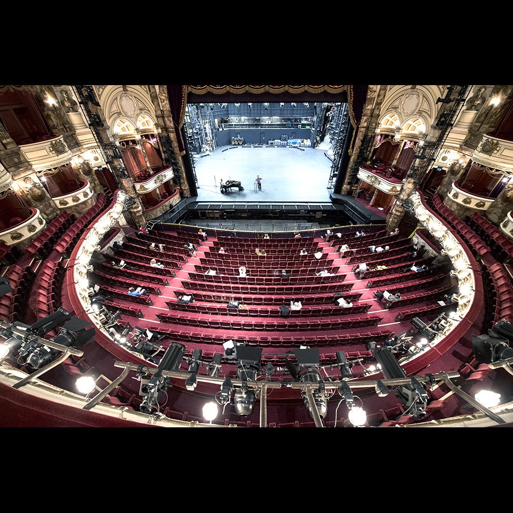 The socially distanced ENO chorus rehearsing at the London Coliseum