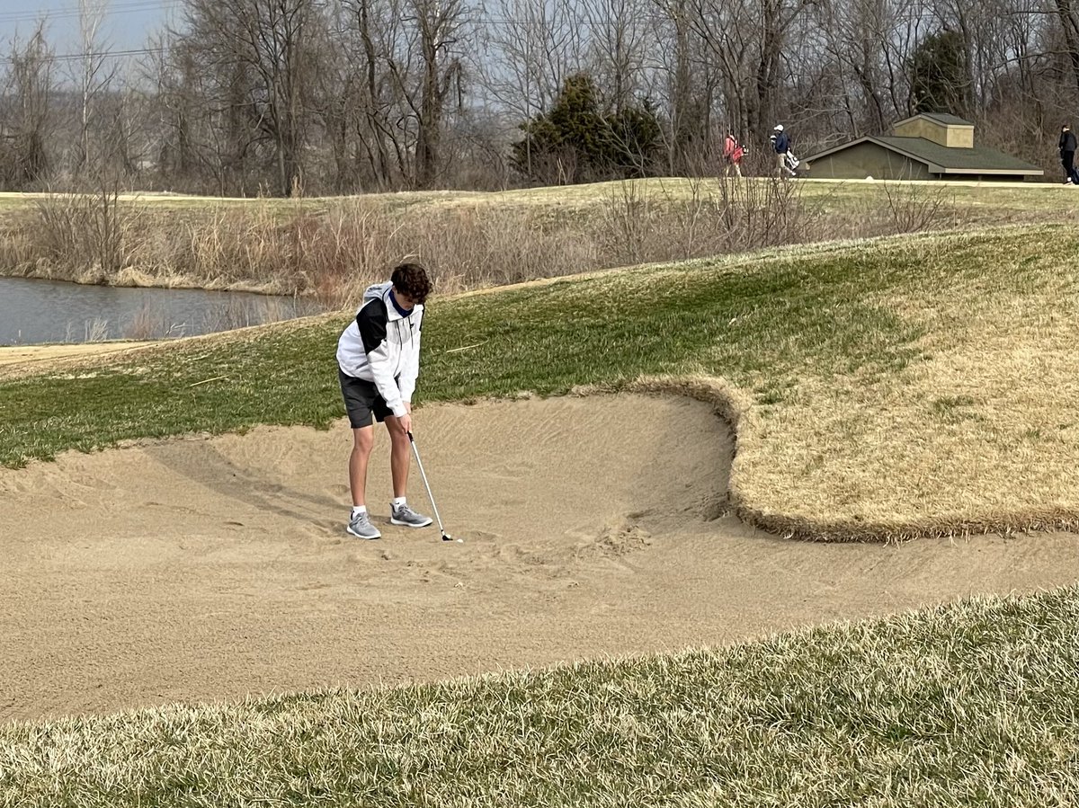 Max Halsey makes a tough shot out of the bunker on his 1st hole of the day.