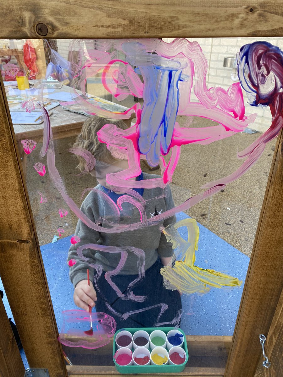 We are enjoying the sunshine today by painting outside. Do you like this pink dinosaur?