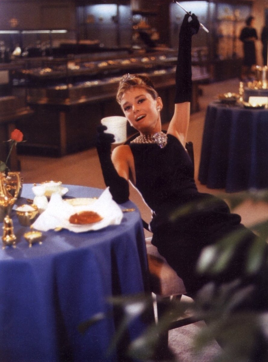 audrey hepburn wearing the iconic givenchy black dress at tiffany & co. for the publicity of 'breakfast at tiffany's' in new york, 1960 audrey hepburn wearing the iconic givenchy black dress at tiffany & co. for the publicity of 'breakfast at tiffany's' in new york, 1960