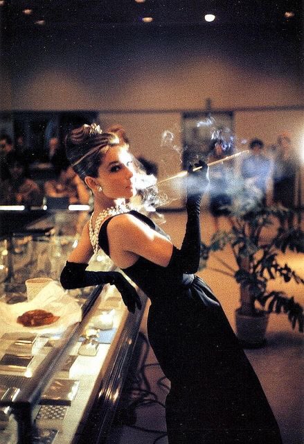 audrey hepburn wearing the iconic givenchy black dress at tiffany & co. for  the publicity of 'breakfast at tiffany's' in new york, 1960