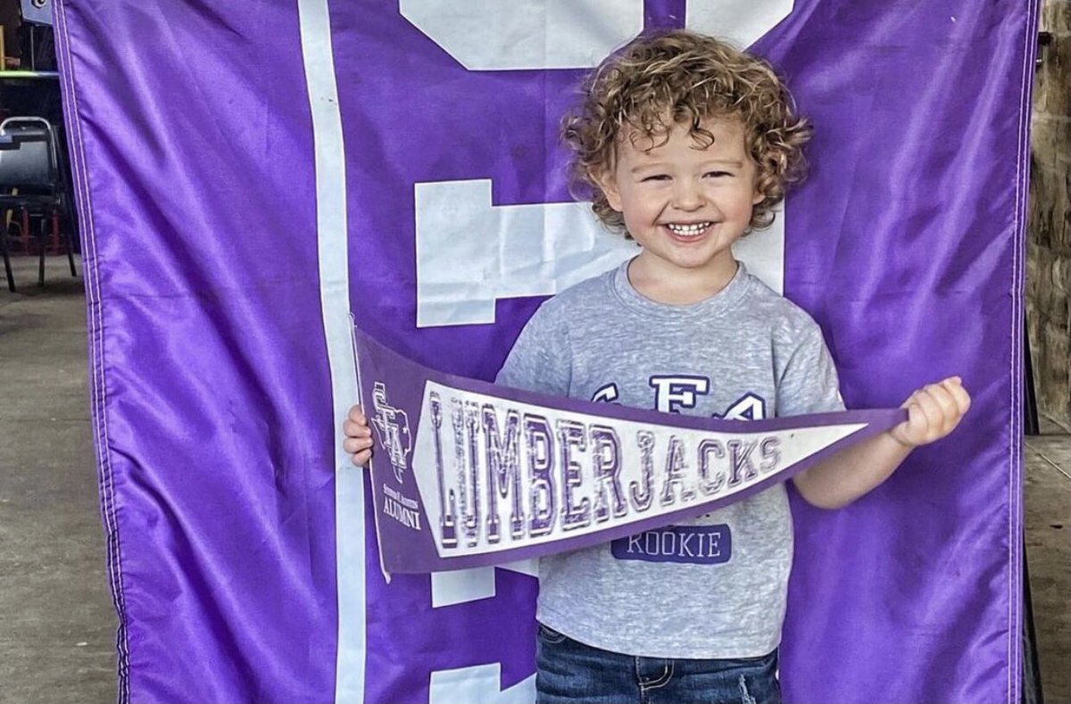 SFASU's tweet photo. If Liam Tomberlain, future Lumberjack class of 2040, doesn’t make you smile, we don’t know what will. Happy Monday, Jacks!
 
📷: Liam Tomberlain, son of alumni Cole and Kendall Tomberlain of Longview, at an @SFA_Alumni women’s basketball watch party yesterday. https://t.co/PCIKh7PZKv