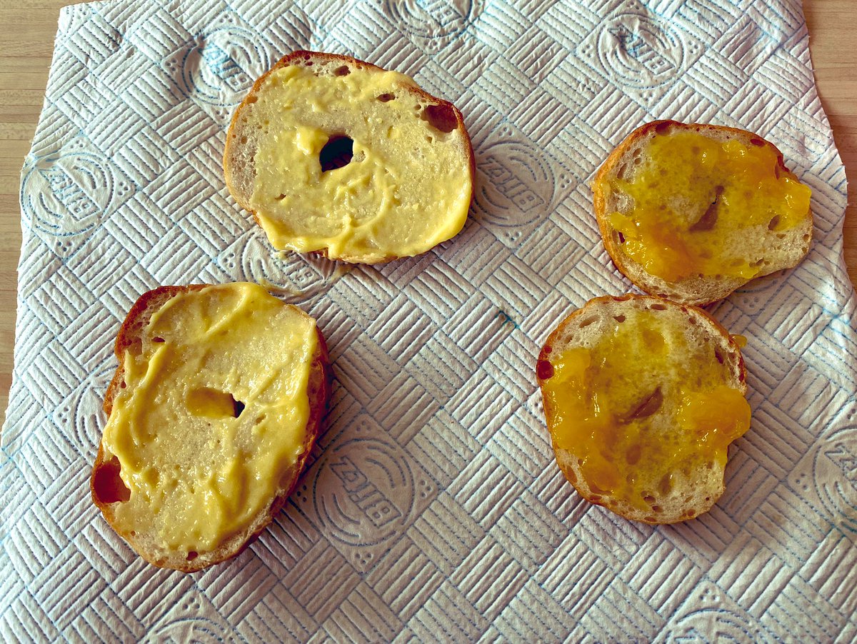 LindaCHoward's tweet photo. Can we talk about the difference in colour between homemade organic Lemon Curd vs high-end supermarket Lemon Curd? 
Both slathered on toasted homemade bagels for the official taste test. 
Totally worth the minimal effort, tastes zingtastic! 🍋🍋 #BlindBaking https://t.co/IRaNtwm25O