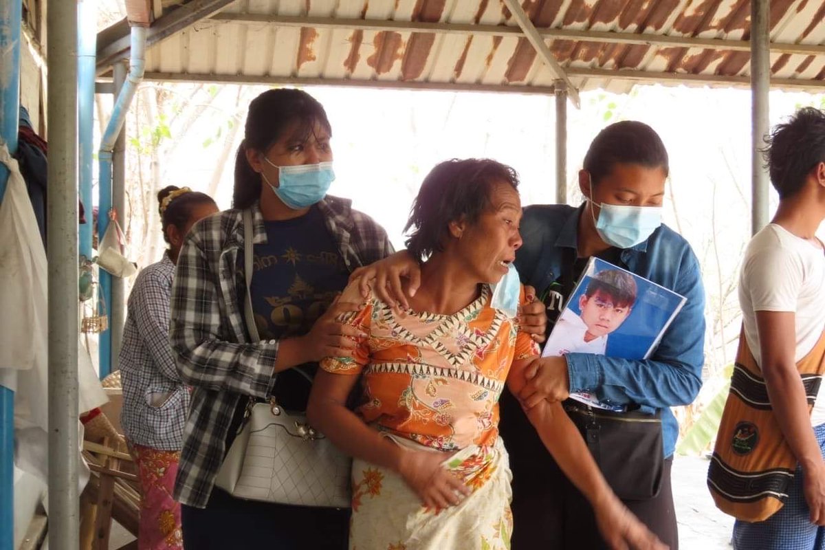 Family members mourn the death of 14-year-old Tun Tun Aung who was shot in the chest by the junta’s armed forces in Mandalay on Monday during a military raid on the Mya Yee Nandar housing complex. At least eight people, including two rescue workers, were killed in the attack.