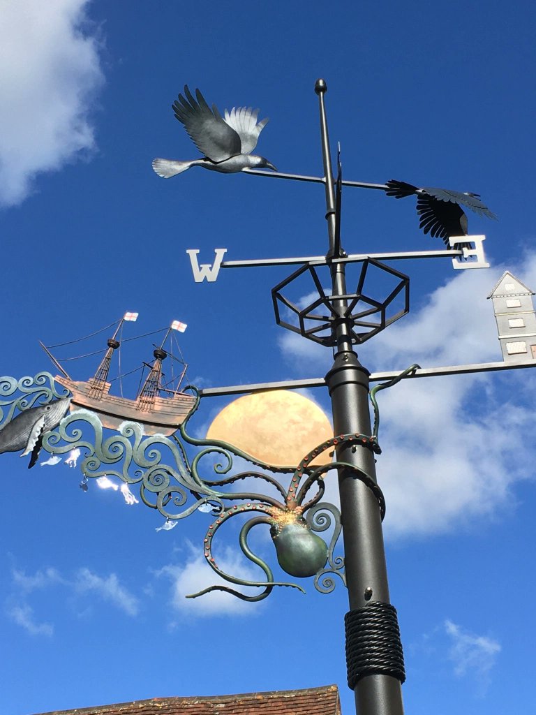 dorkingmuseum's tweet photo. Well - this is a beautiful thing. This piece by the Fire and Iron Gallery company commemorates #Dorking's @mayflower400uk heritage. The artwork is located in the passage leading to @Waitrose, close to the Museum and William Mullins’s house.

https://t.co/iYwekBX4XR https://t.co/XGyJHpRT0q