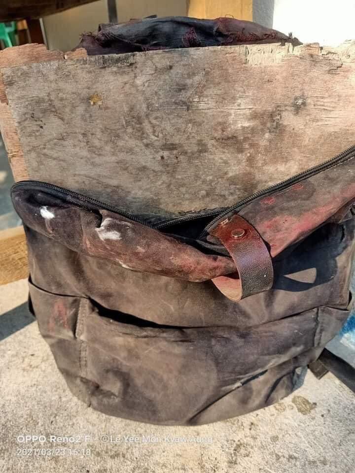 PhyoNyeinPaing2's tweet photo. This poor boy carried 3 sheets of DIY plywood in his bag hoping to prevent the bullet but it didnβt save him from #AungPinLel crackdown by Junta forces and he was shot in the head. Devastating!#WhatsHappeningInMyanmar #Mar23Coup https://t.co/AzxqbWzE9J