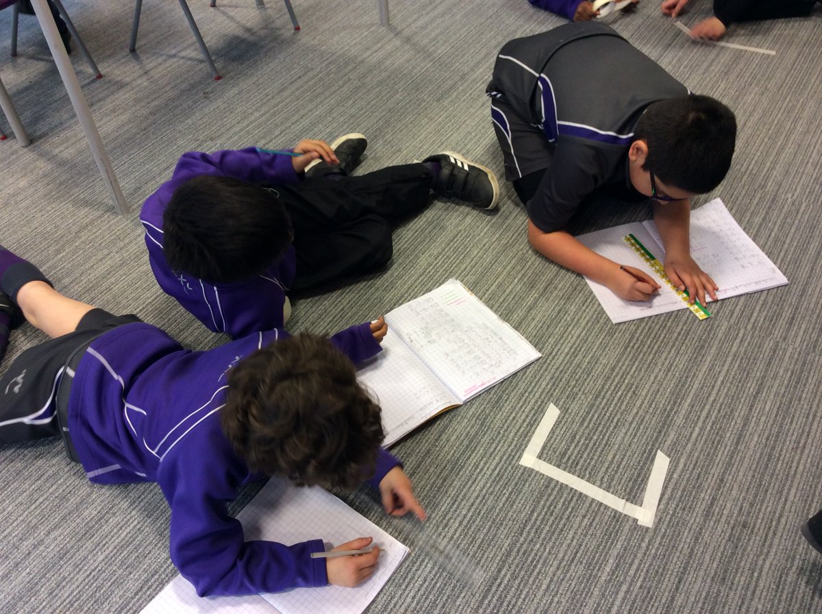 BansteadPrep's tweet photo. #Year3 revising perimeter and having some Easter fun. They are making rabbit or egg shapes from masking tape, measuring the perimeter and recording this in their books. #BPS_Maths https://t.co/GU0dXdci1C