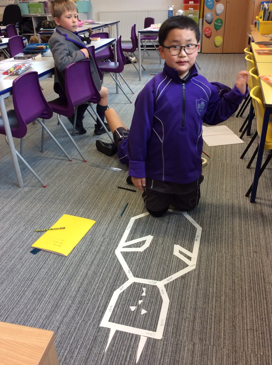 BansteadPrep's tweet photo. #Year3 revising perimeter and having some Easter fun. They are making rabbit or egg shapes from masking tape, measuring the perimeter and recording this in their books. #BPS_Maths https://t.co/GU0dXdci1C