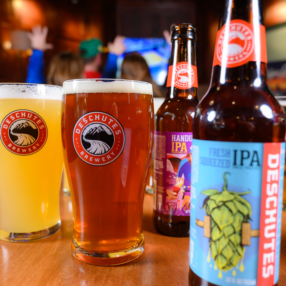 DeschutesBeer's tweet photo. Last year we had a photoshoot right before live sports were cancelled. 🏀 So much has changed and we know it's tough, but we’re happy to give you a familiar brew &amp; we’re thankful that you all have stuck with us.

Cheers to you, and continuing to get back to normal! 🍻 https://t.co/uFLupoirC8