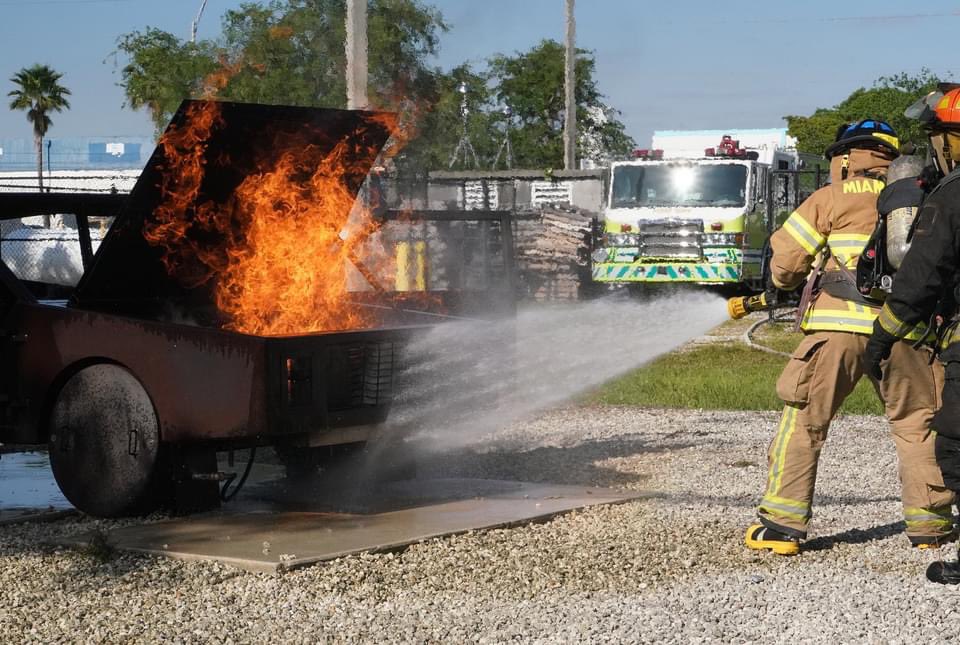 MiamiDadeFire's tweet photo. #MDFRClass145 was back on the drill ground on Tuesday morning with live fire training. With car fires a common occurrence these days, the recruits practiced vehicle fire attacks using a car prop at the Miami-Dade College North Fire Academy. #MDFRTraining https://t.co/gTpb1qZ3LY