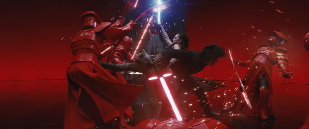 Snoke's unexpected death leads Kylo and Rey to fight together against his Praetorian Guard.The text explains that their bond strengthens with every passing moment, their abilities amplifying each other's.