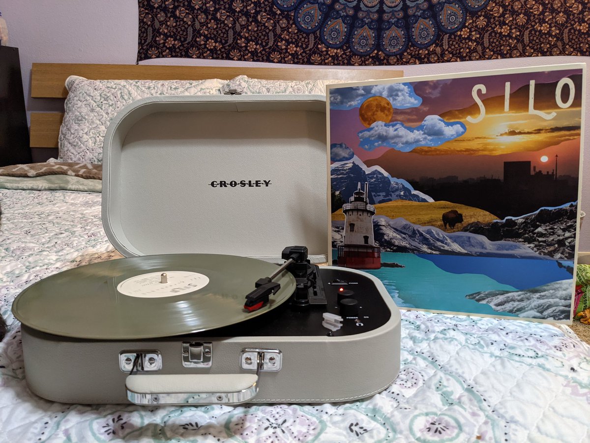 Rebekah_B_'s tweet photo. @altogetherband Charlie and I are jamming out to the vinyl 😍 mine's camo colors 🌱 https://t.co/YQM0aNij0X