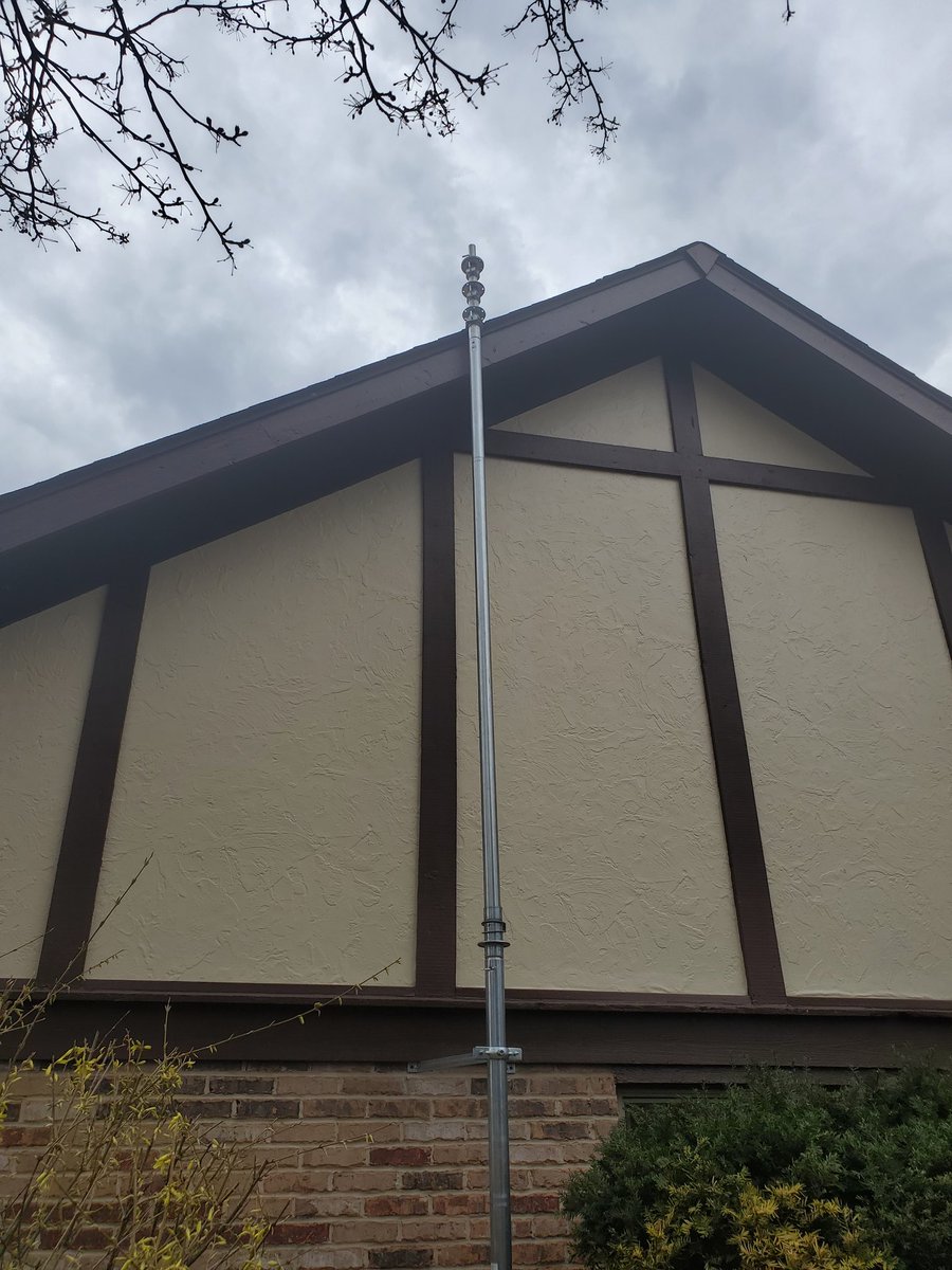 W8Lrj's tweet photo. Lots of progress in the nice weather! Got the cement poured and installed the base in it yesterday. Today we got the mast secured in the base and the wall brackets. Next just attach the antennas and extend the mast to 40 feet! https://t.co/bAQw0JZOzi