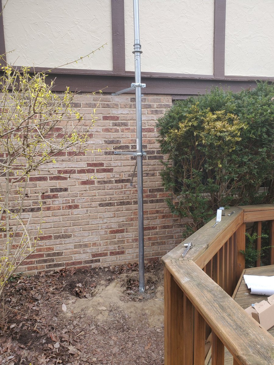 W8Lrj's tweet photo. Lots of progress in the nice weather! Got the cement poured and installed the base in it yesterday. Today we got the mast secured in the base and the wall brackets. Next just attach the antennas and extend the mast to 40 feet! https://t.co/bAQw0JZOzi