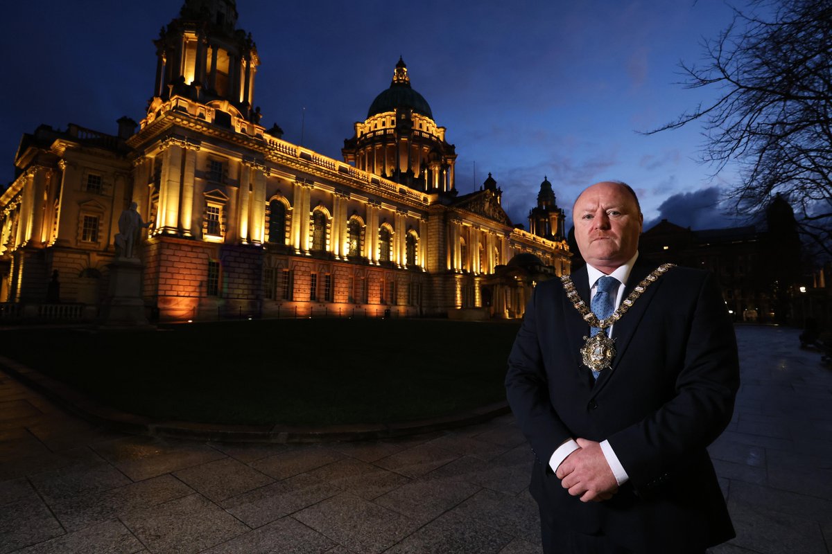 belfastcc's tweet photo. Lord Mayor @frankmccoubrey at Belfast City Hall this evening which joined other iconic buildings &amp; landmarks across the UK lighting up  in yellow for @mariecurieuk 's #DayOfReflection marking a year since the first lockdown -  https://t.co/ksGqe7oTnm   #BelfastLightsAtNight https://t.co/EwhoGHAEi1