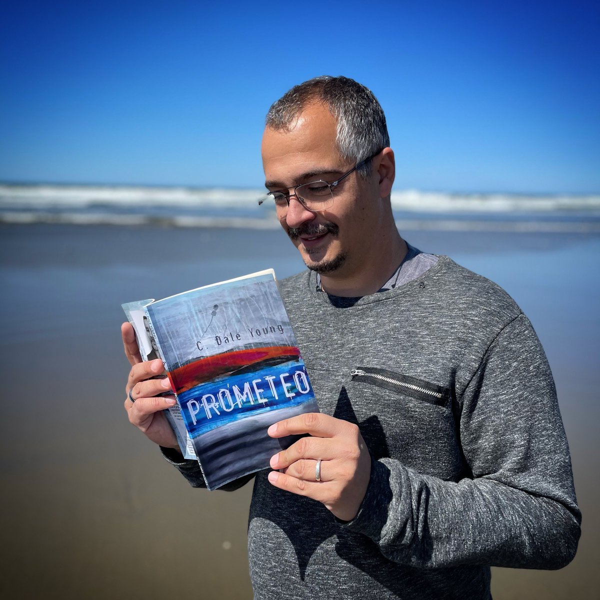 isaiasfanlo's tweet photo. Spring weather in Spring break! Reading by the ocean and taking the sun in. Thrilled to see #cdaleyoung outdoing himself with his new book #Prometeo! @FourWayBooks https://t.co/hAp5BGy405