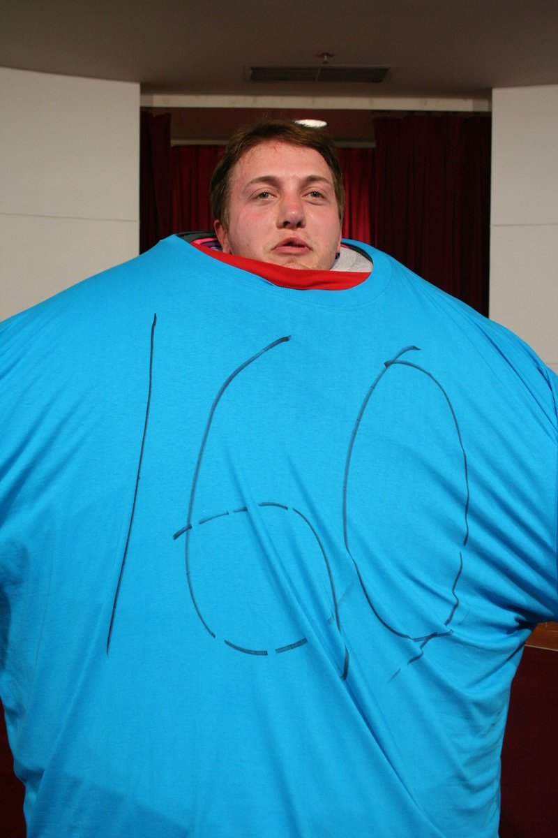 GoodAaron's tweet photo. FUN FACT: In college, I broke the Guinness World Record for most T-Shirts Worn at Once by a Single Human Being. 

It's been pointed out these photos no longer exist online anymore... so here there are.  My life is strange! https://t.co/GVgj00uy1B