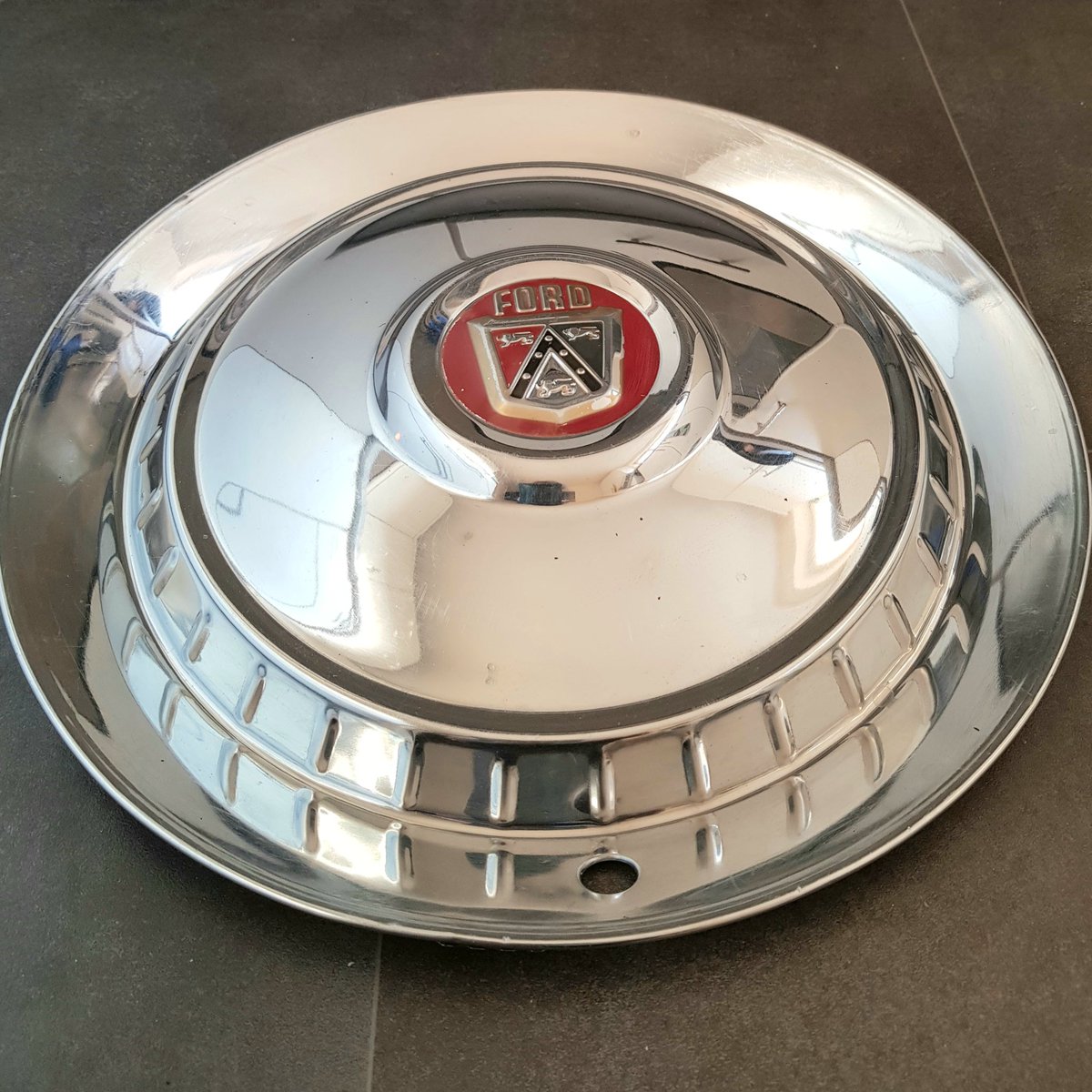 DawnSunrise1's tweet photo. During the time that Dad flew Vulcans, he bought a huge American Ford car. It was quite a sight as Dad drove it around RAF Finningley, where we lived. This beautiful hubcap is all that's left of the car. A treasured possession.
@vulcantothesky @558Sqn @XH558 #VulcanPilot https://t.co/7TSNOTuKYX
