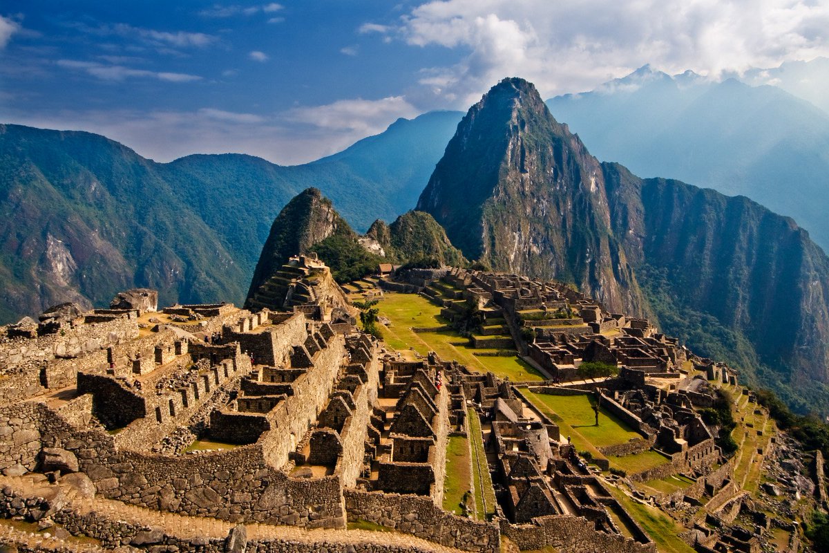 Machu Picchu! It's a 15th century Inca citadel perched high up in the Andes Mountains of southern Peru. It's located on a 7,970 ft tall ridge. It's believed it was originally intended as an estate for the Inca emperor Pachacuti. It was never actually found by the Spanish.......