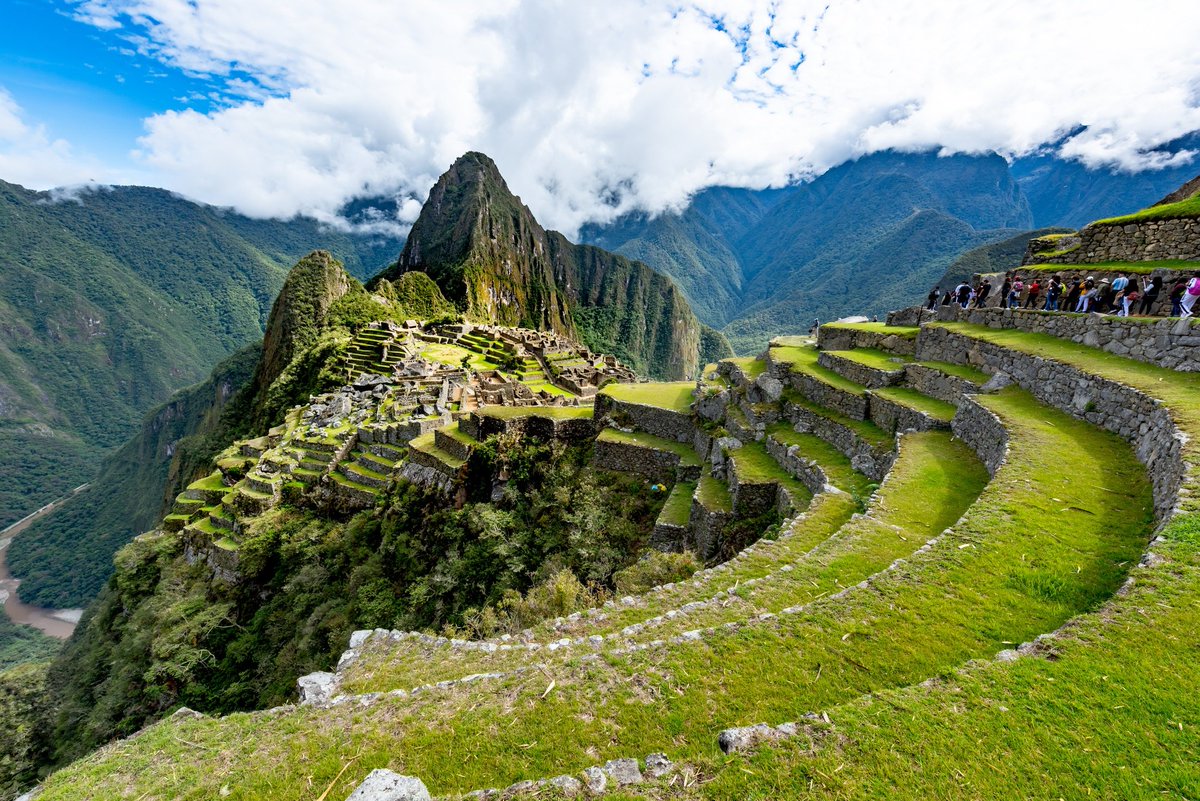 Machu Picchu! It's a 15th century Inca citadel perched high up in the Andes Mountains of southern Peru. It's located on a 7,970 ft tall ridge. It's believed it was originally intended as an estate for the Inca emperor Pachacuti. It was never actually found by the Spanish.......