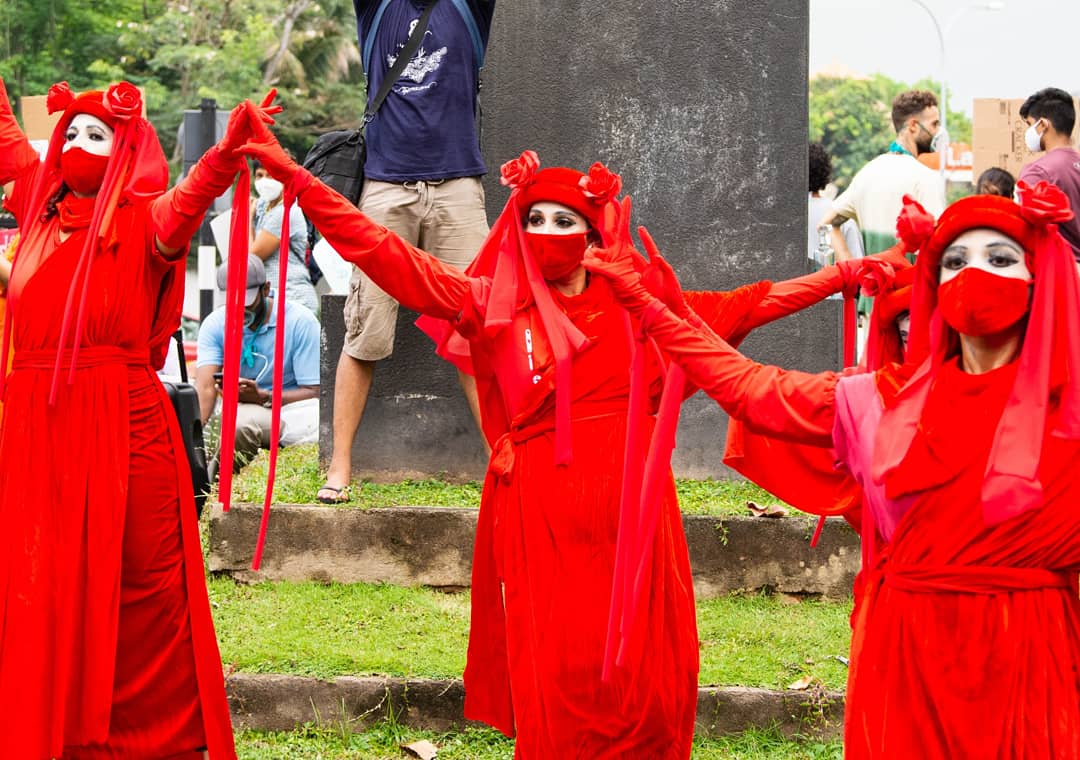 XRebellionLK's tweet photo. The Red Rebel Brigade made its first appearance in SL on the 19th March Climate Action to #stopecocidesl. They are a group dedicated to the global #climateemergencgy and supports #ExtinctionRebellion to save all species from Extinction.♥️#lka https://t.co/sNOYCsTvMp
